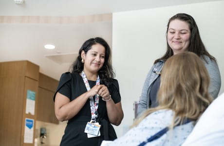 A Geisinger Interpreter works with a patient