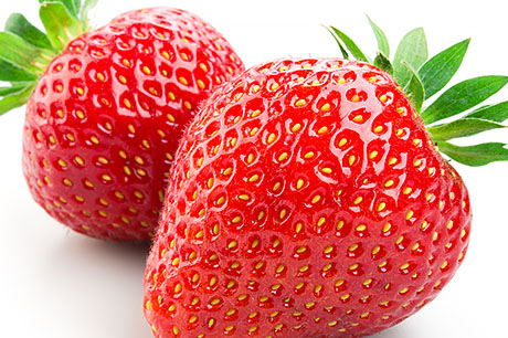 A closeup photograph of strawberries.