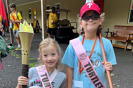 Two young girls attend a camp for children with special needs.