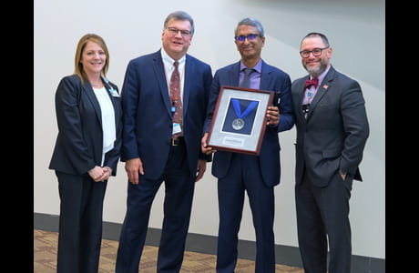 Pugazhendhi Vijayaraman, M.D., system chief, clinical electrophysiology, second from right, received Geisinger’s 2023 Henry Hood Award for Clinical and Research Excellence. Pictured with him are Christa Martin, Ph.D., chief scientific officer; Alfred Casale, M.D., chief medical officer, surgical services and chair, Geisinger’s Heart & Vascular Institute; and George Ruiz, M.D., MBA, system chair, cardiology and vice chair, Geisinger’s Heart & Vascular Institute.